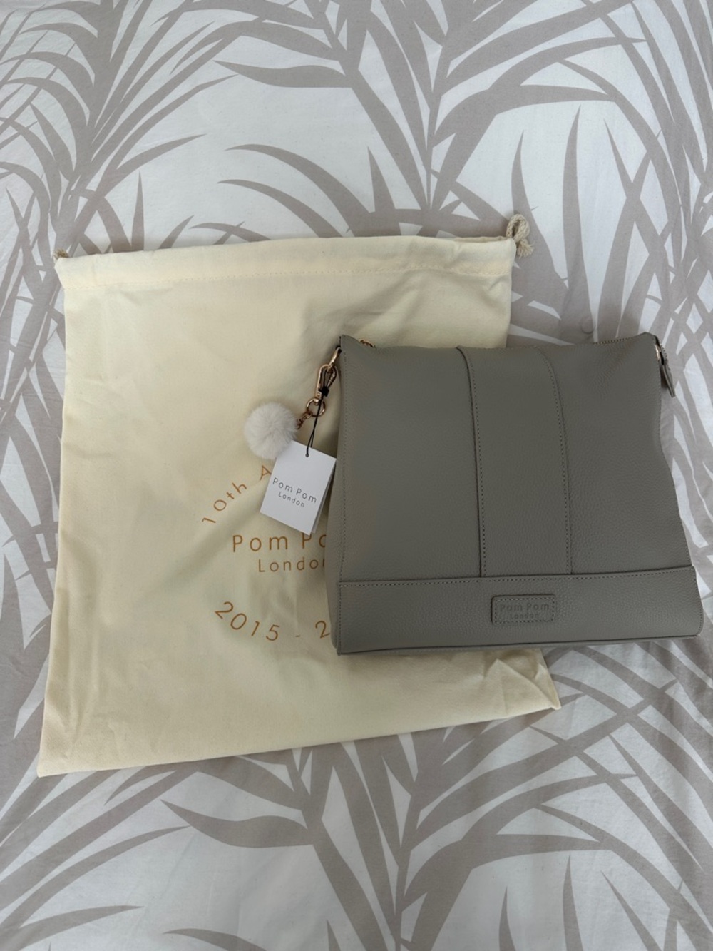 Gray Pom Pom London Leather Crossbody Bag with straps and wallet